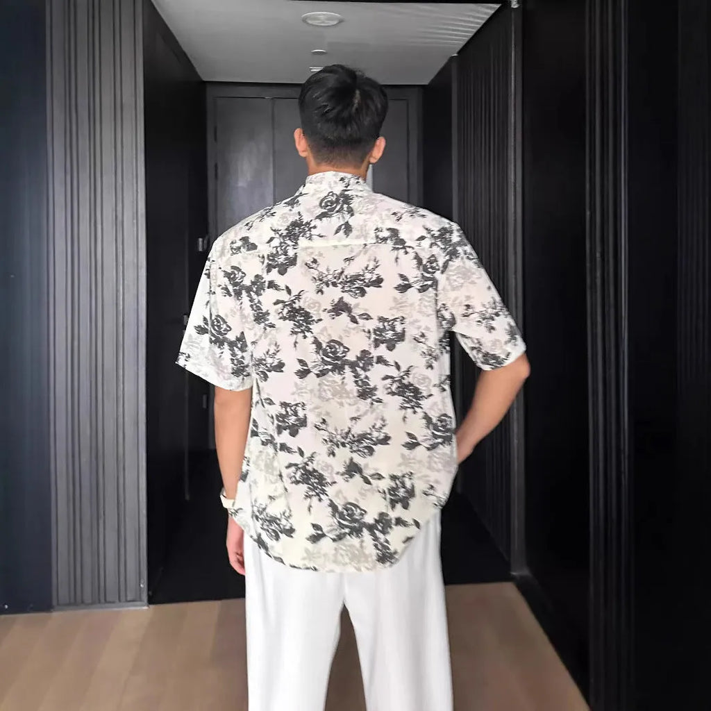 Loose fit floral printed short sleeve shirt in white or black with pendant-style front