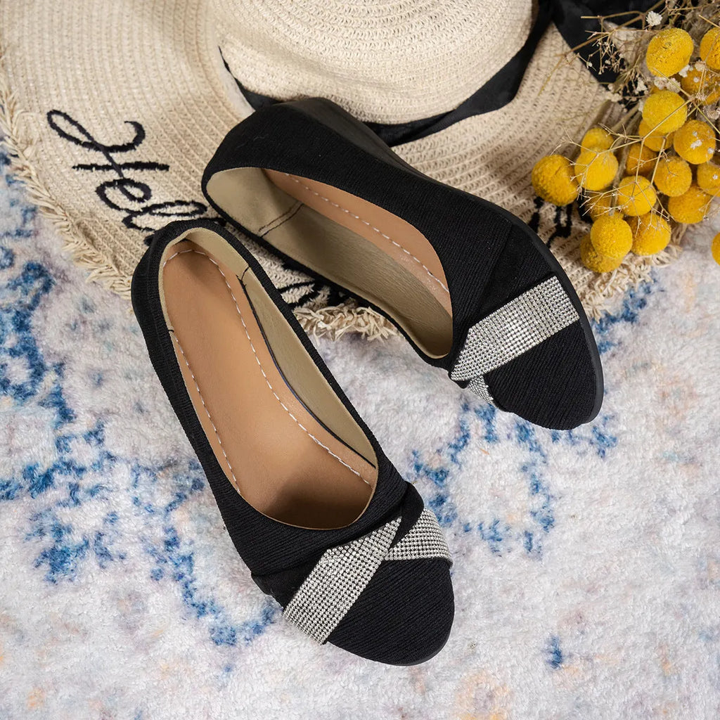 Black women's slip-on casual shoes with a chunky heel and rhinestone details on the fabric upper.