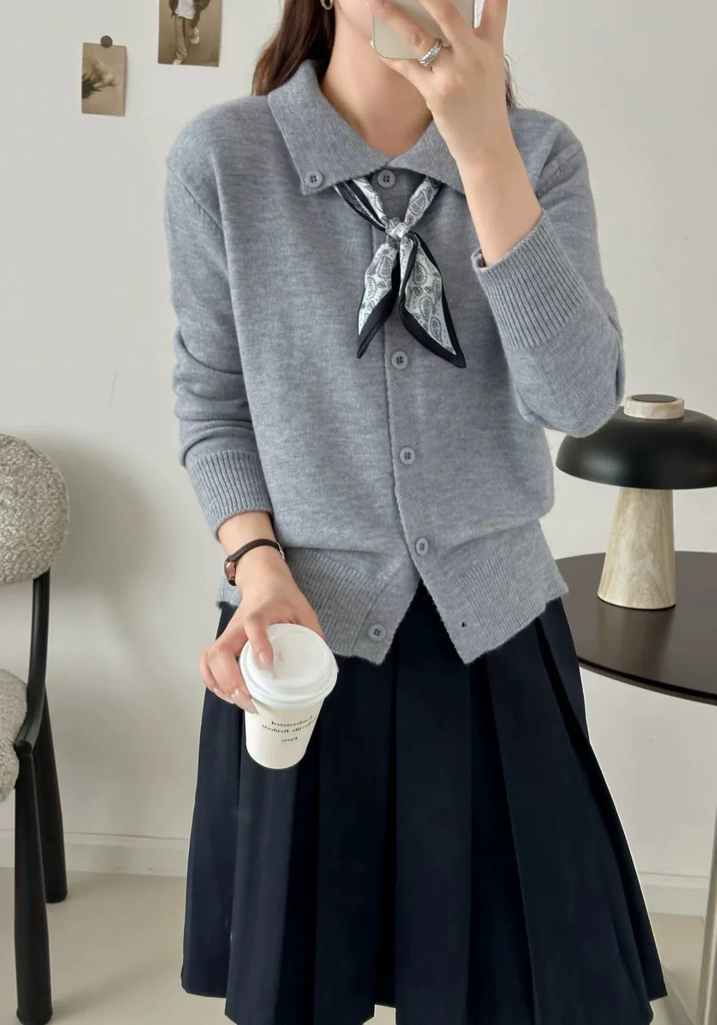 Milky white lazy fashion lapel scarf cardigan sweater with splicing detail and long sleeves.