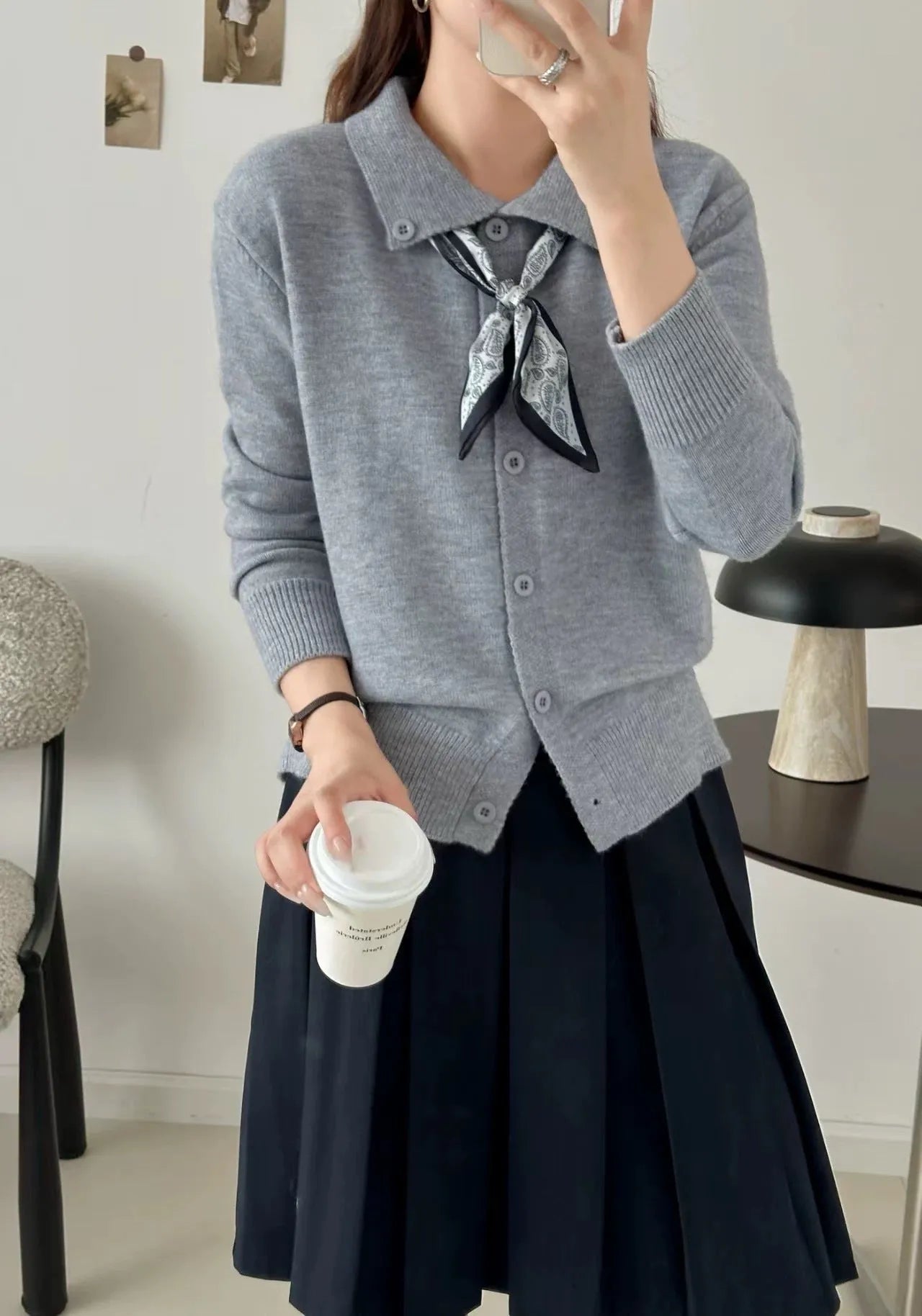 Milky white lazy fashion lapel scarf cardigan sweater with splicing detail and long sleeves.