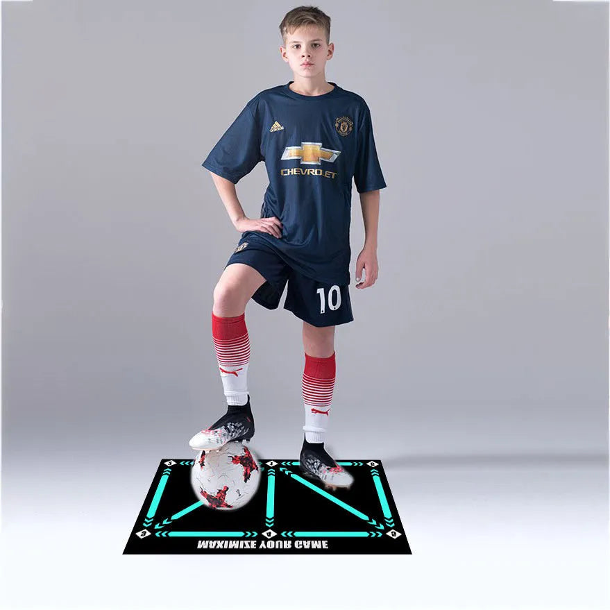 Black rectangular football training mat with non-slip backing measuring 60cm by 90cm