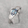 Geometric ellipse zircon ring in white gold finish showing structured design and stone detailing