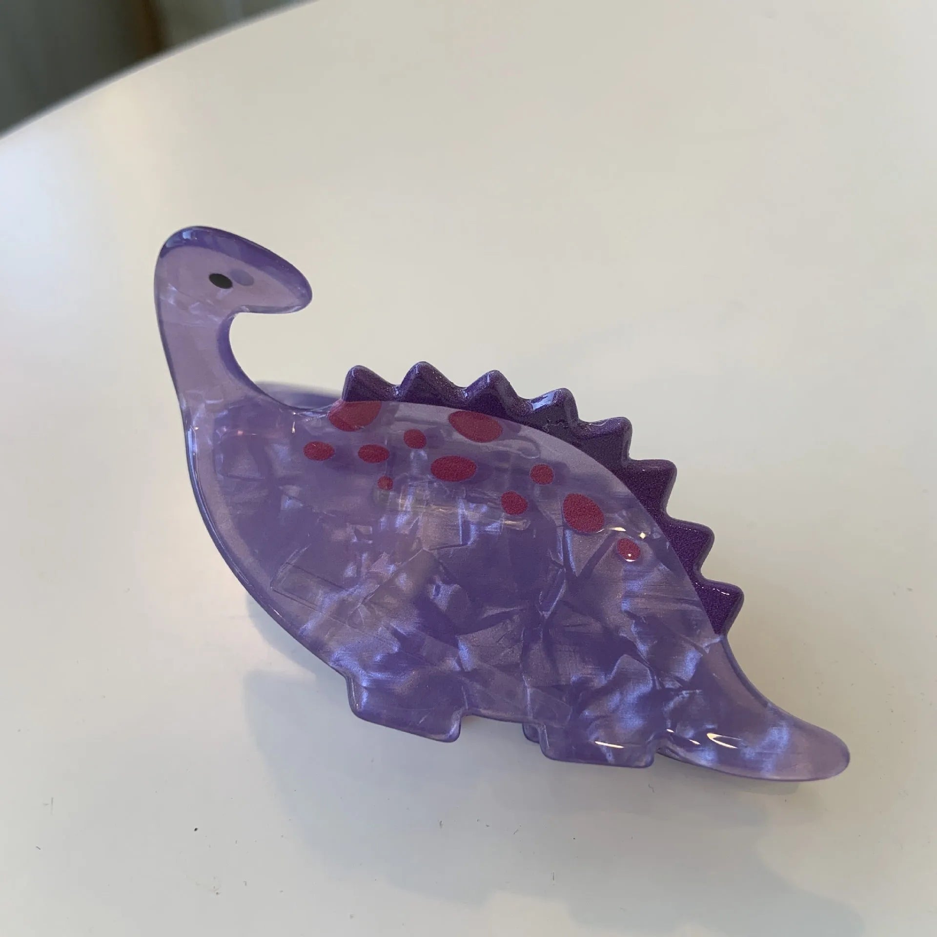 Acrylic dinosaur-themed hair clip with jaw grip design in one of six colour variations