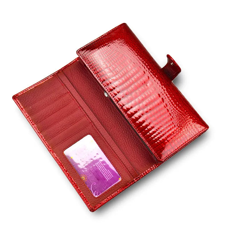 Women's red patent leather coin purse with a crocodile-embossed texture.