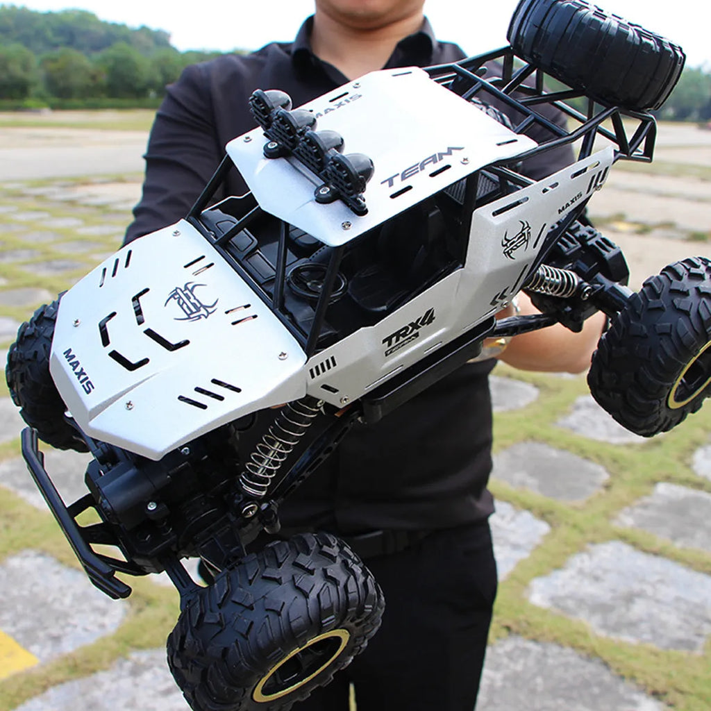 Black and silver remote control cars showcasing 28cm and 37cm four-wheel drive models with wireless controllers