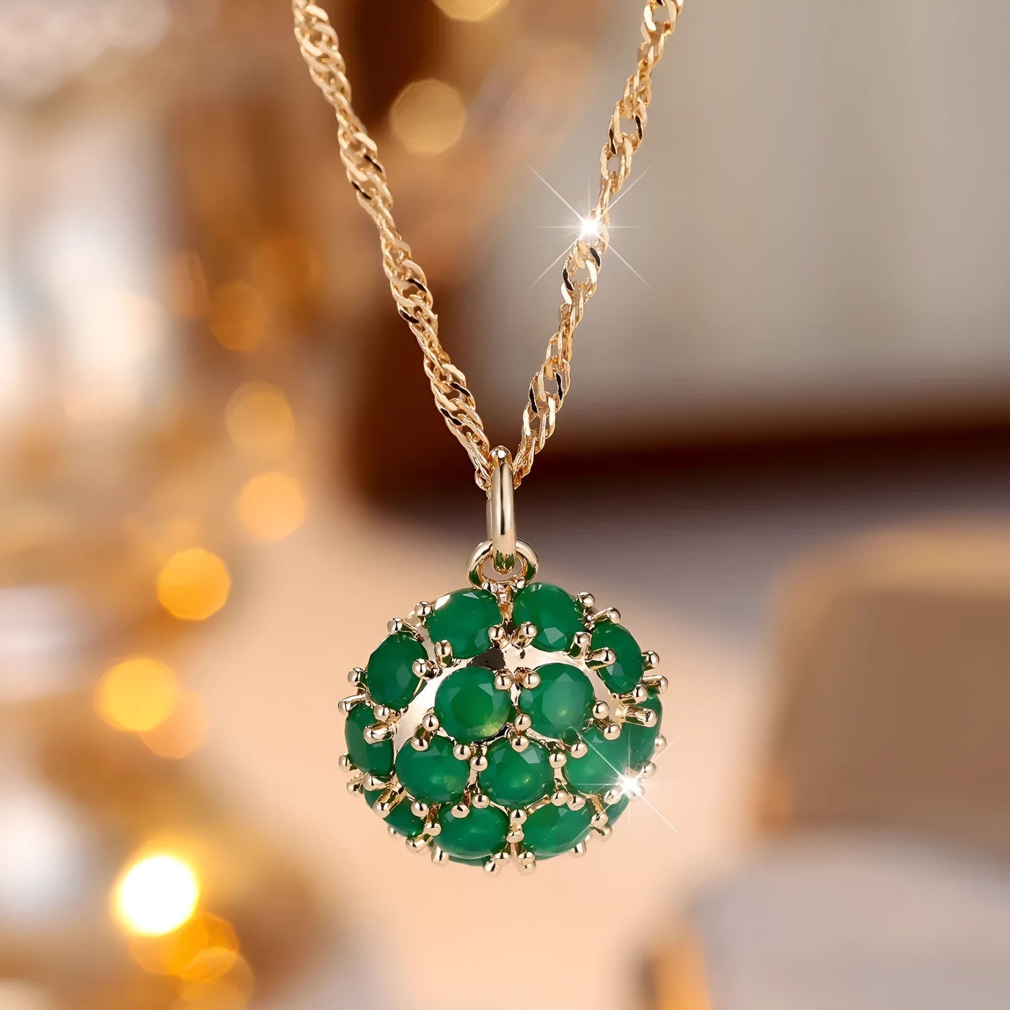Round pendant necklace with emerald diamond elements on champagne gold electroplated chain