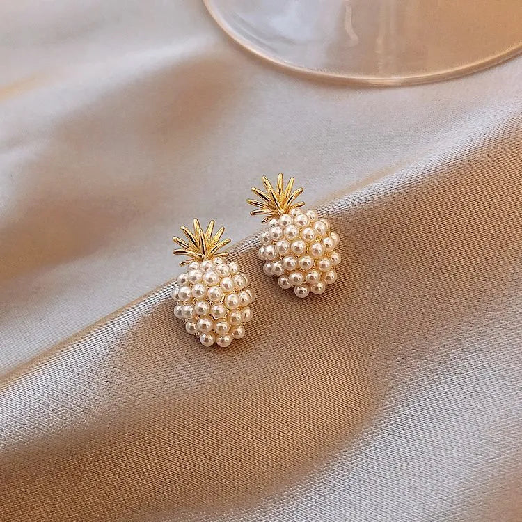 Pineapple and starfish motif drop earrings with pearl and artificial gemstone details on alloy metal