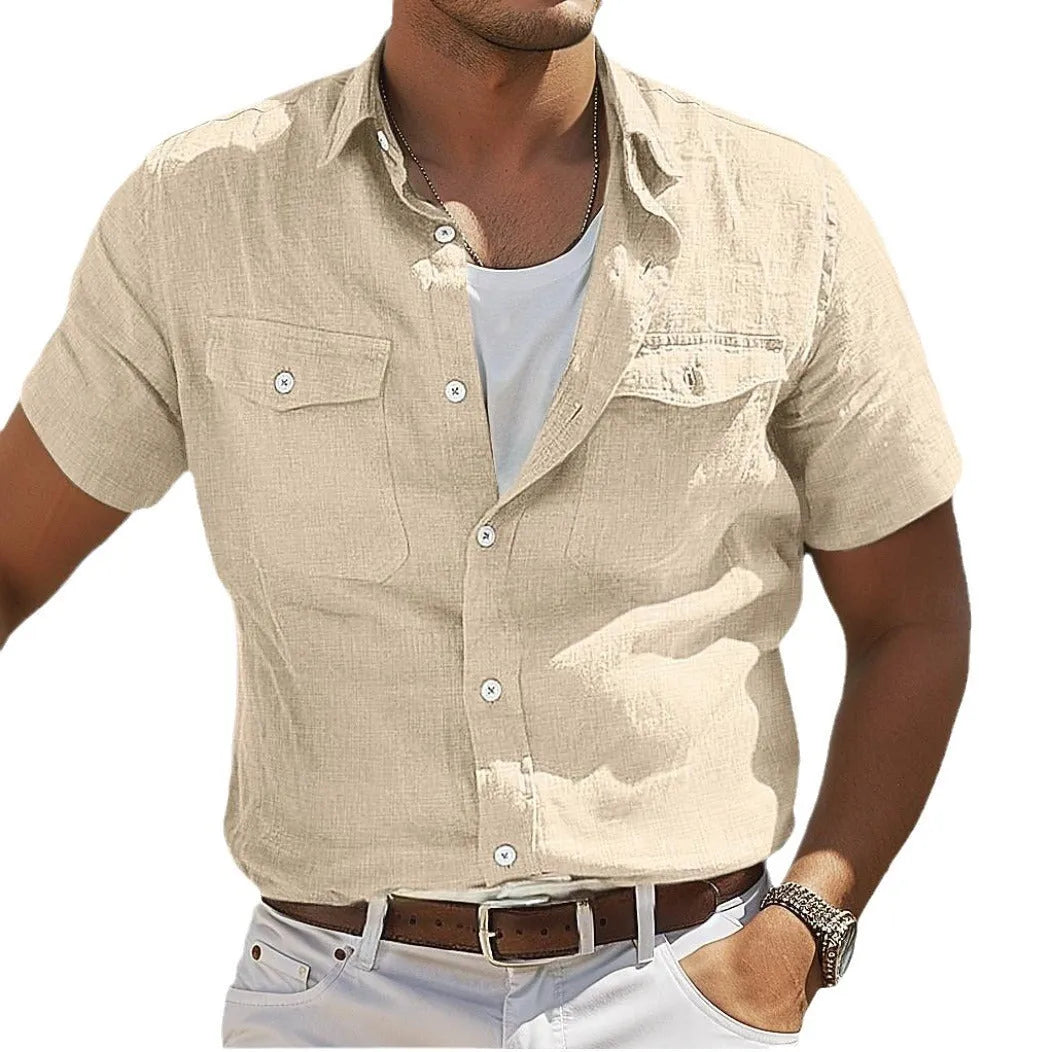 Man wearing a loose grey cotton cardigan-style shirt with a polo collar and long sleeves.