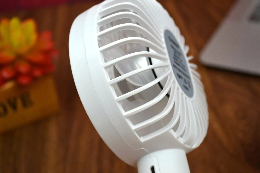 White ORICO FH1 portable USB rechargeable fan with three-speed control on desktop