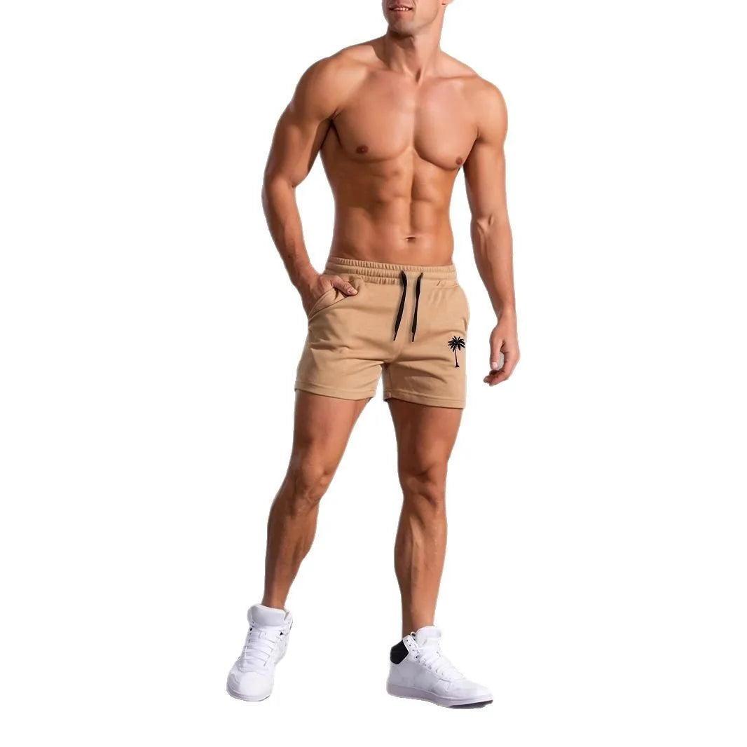 A pair of khaki men's casual shorts featuring a coconut print, shown in a straight-leg sports style.