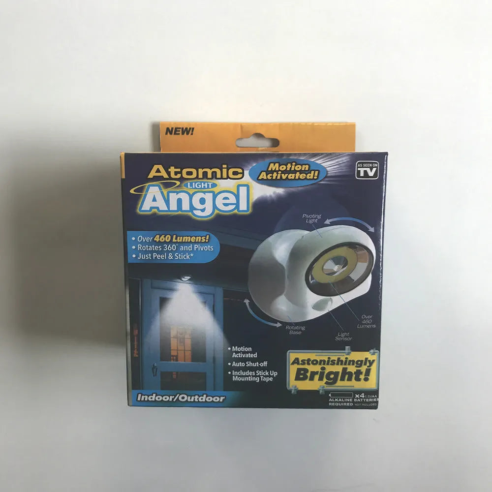 White Atomic Angel induction light with dimensions 13.3cm by 9.8cm by 15.8cm