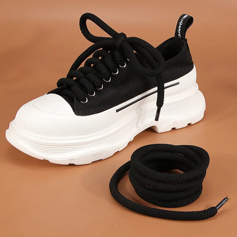 Round white woven shoelace on a grey background showing its 10mm diameter and textured weave.