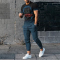 Man wearing a printed short-sleeve T-shirt and matching trousers from a polyester sports set.