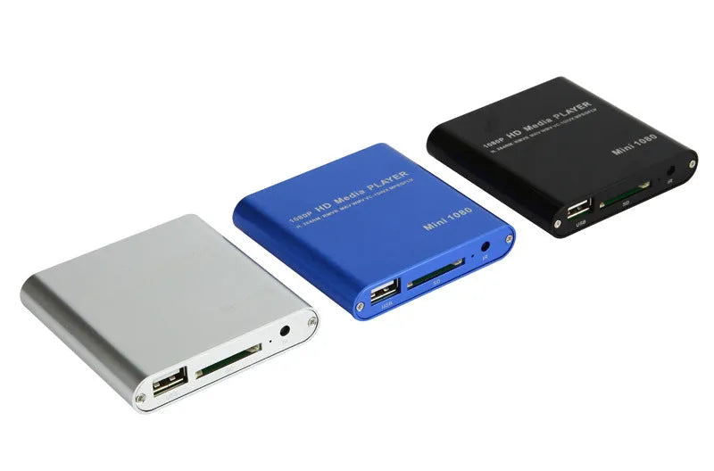 Compact black and blue all-metal 1080p HD media player with remote control on a wooden surface.