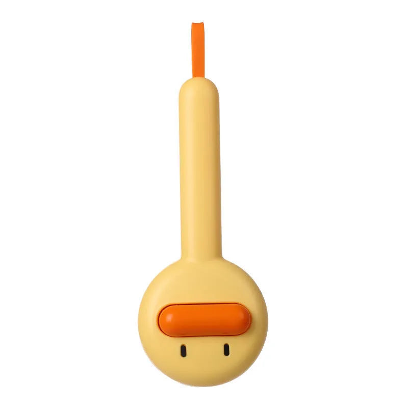 Small yellow duck-shaped pet comb with needle bristles for hair removal on cats and dogs.