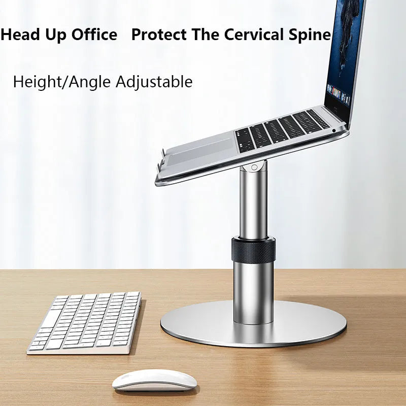 Silver aluminium car laptop stand shown at an adjusted height on a surface.