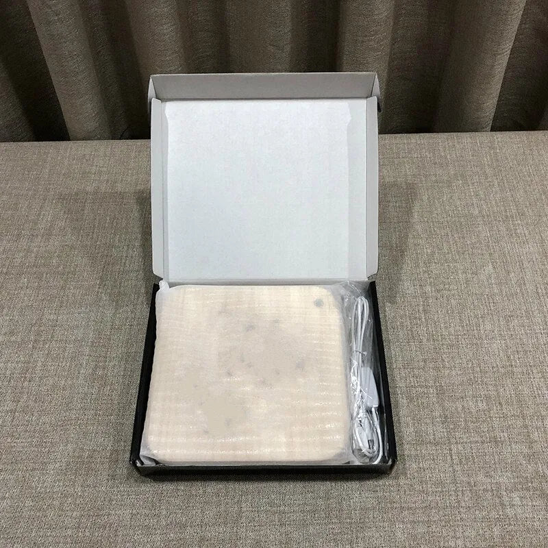 Square pine wood USB LED lamp with warm white light on a desk.