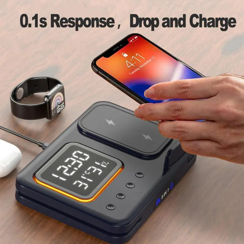 Black 5-in-1 wireless charging station showing phone charging alongside digital clock with temperature display