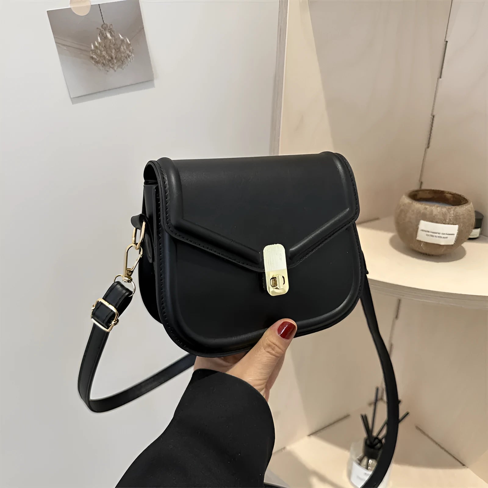 Soft PU leather messenger bag with clamshell opening in a horizontal square shape.