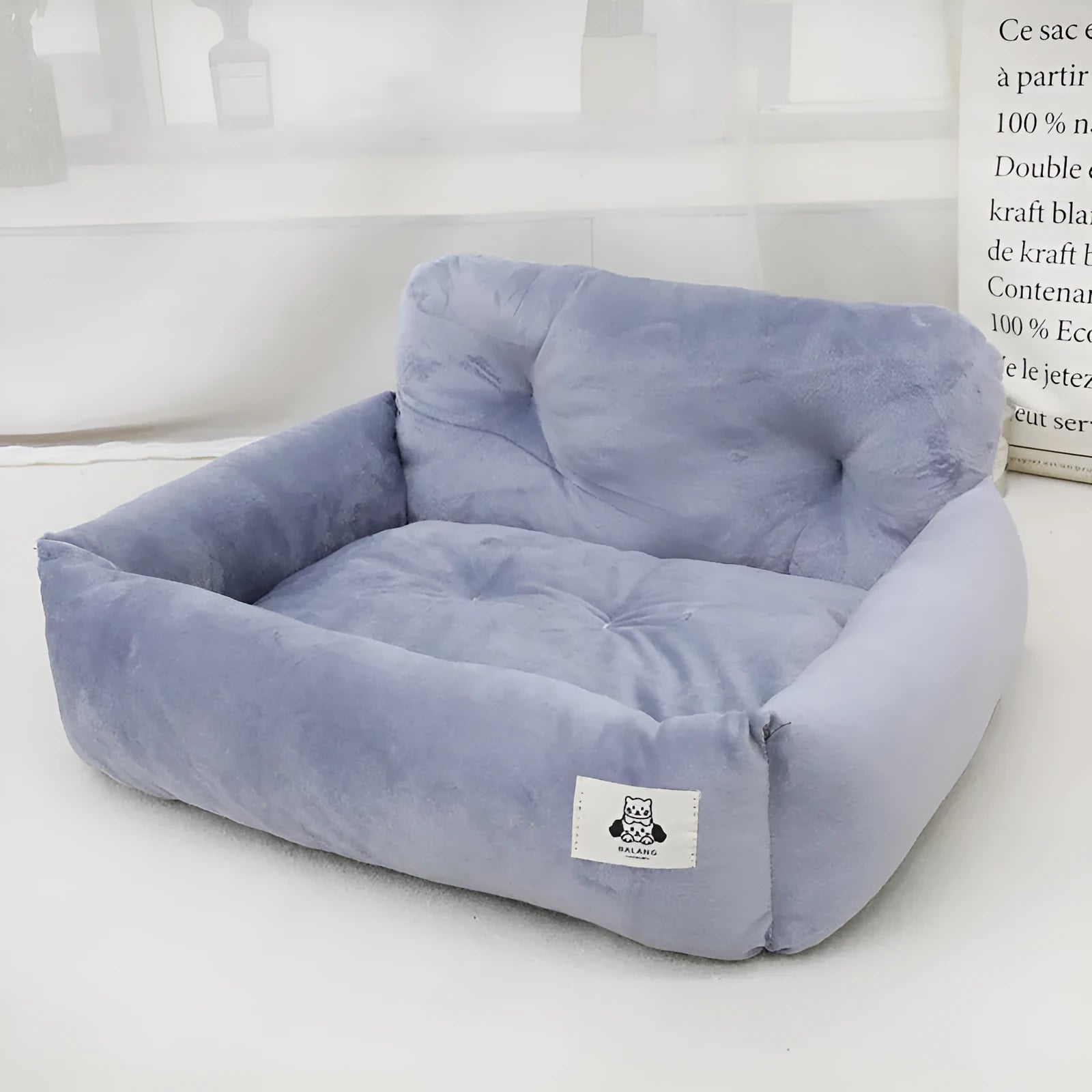 Grey and blue plaid cloth dog nest for car travel, shown in small and large sizes.