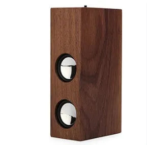 Wooden Bluetooth speaker in bamboo, black walnut, or sapele finish with 7-hour battery.