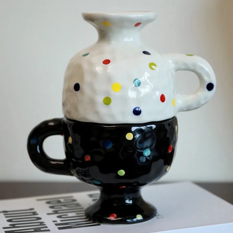 Hand-pinched ceramic mug with irregular shape and solid-colour finish, approximately 14.5cm tall
