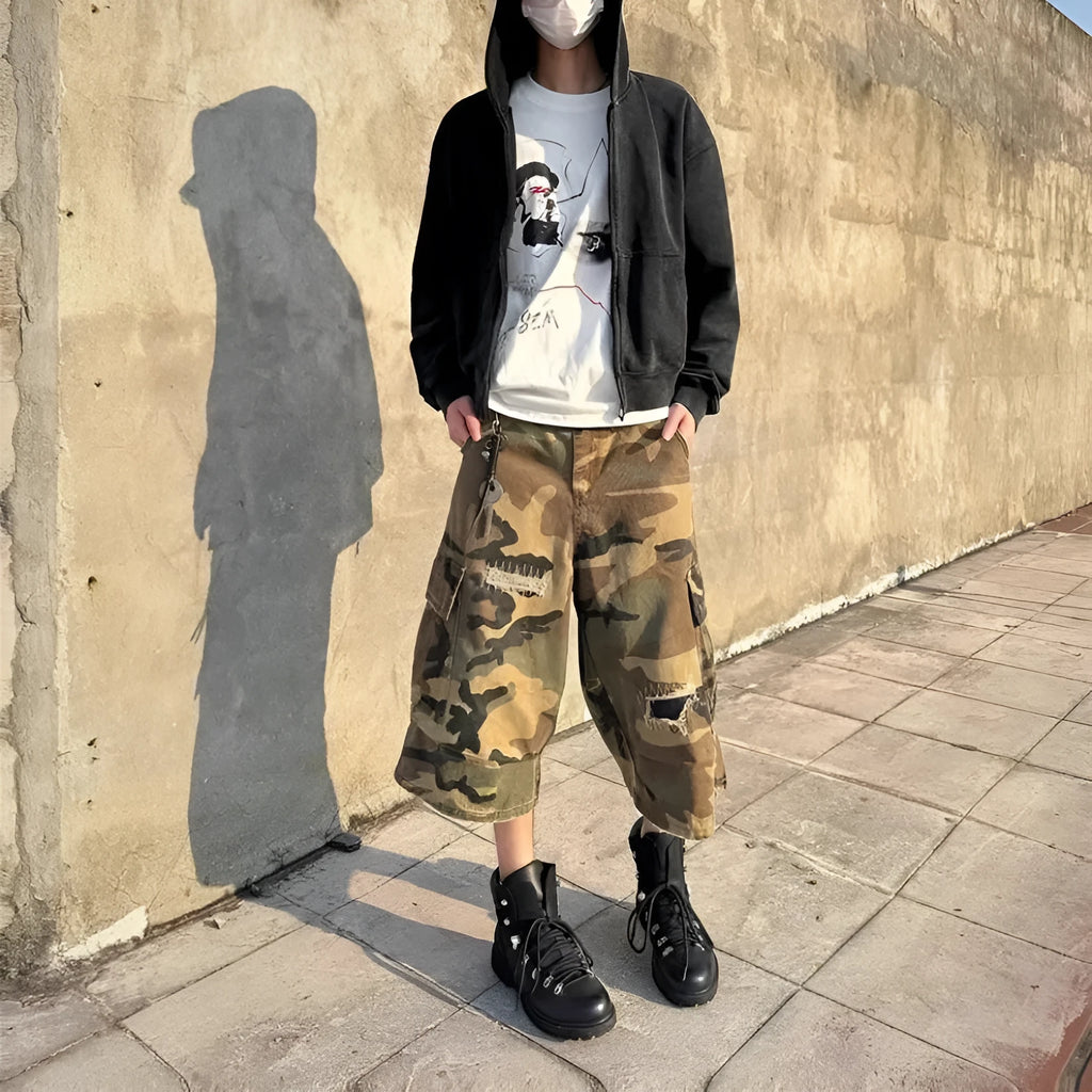 Men's camouflage cropped jeans with patchwork and ripped details in loose straight cut