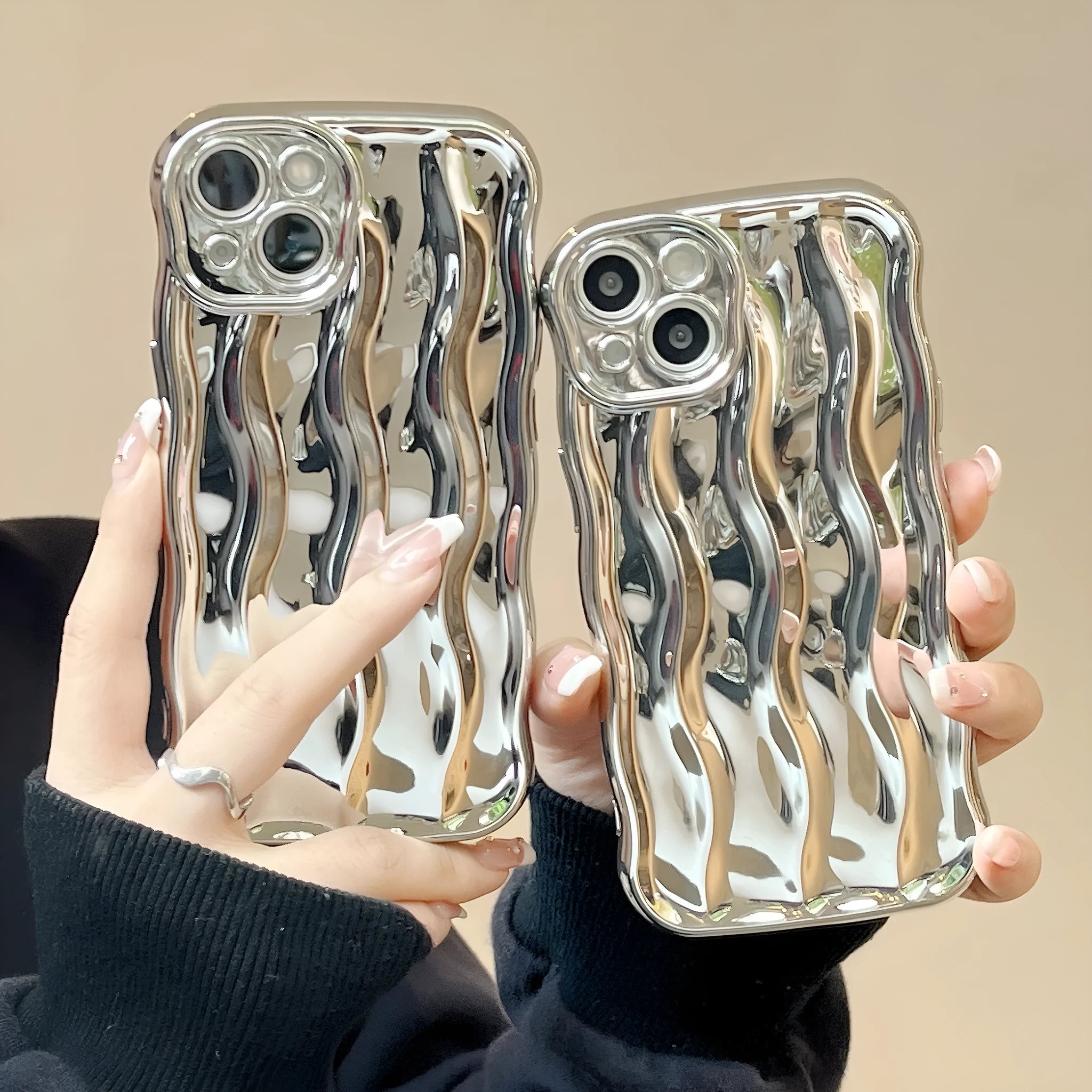 Electroplated wave stripe pattern on a black TPU protective case for iPhone 17 Pro Max.