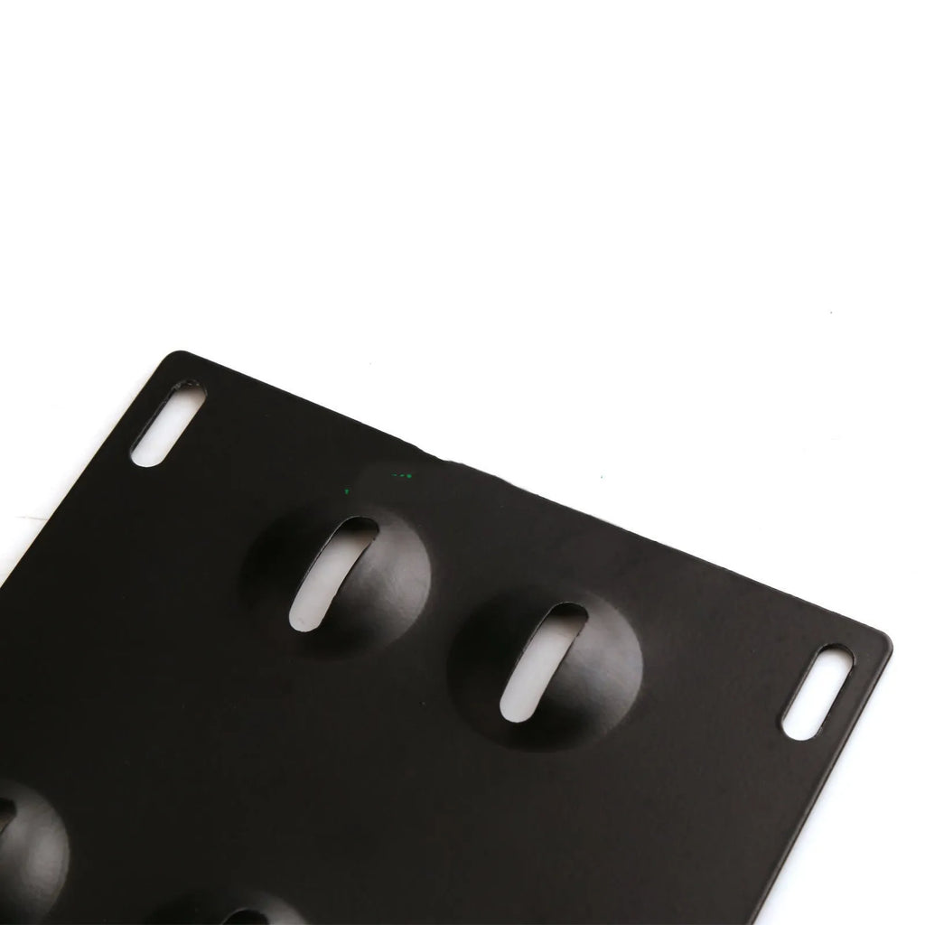 Silver metal car licence plate frame with a central towing hook, next to screws and a nut.