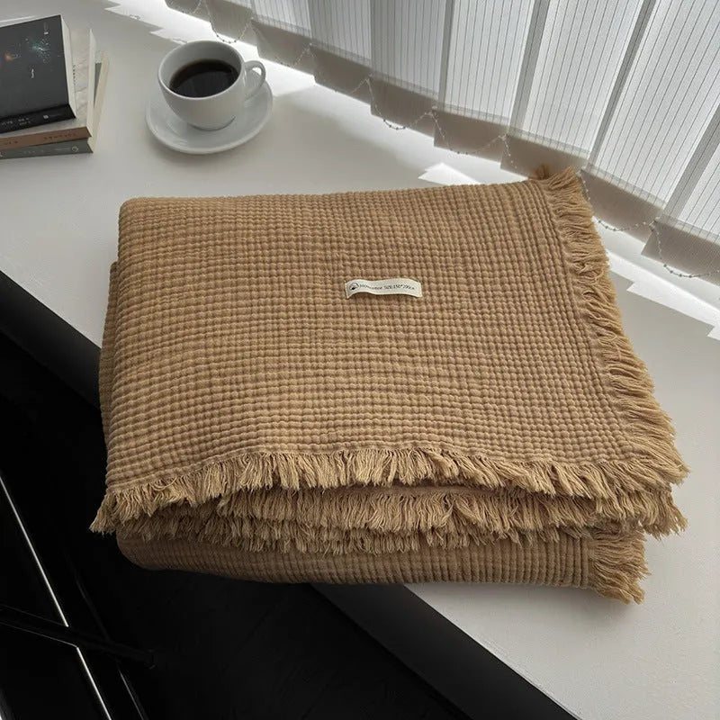 Four-layer cotton gauze blanket with tassel edge in a choice of ten colours.