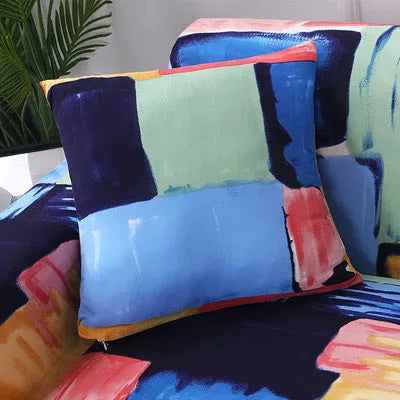 Geometric patterned stretch sofa slipcover fitted on a three-seater sofa in a living room.