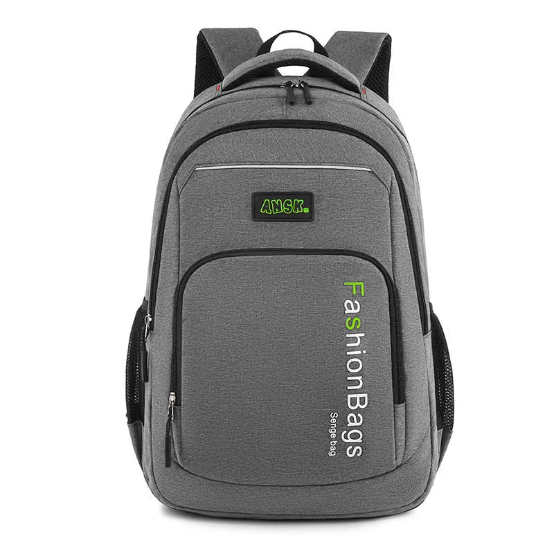 Black nylon backpack with multiple zippers and double shoulder straps shown open to reveal internal laptop and organisation compartments.
