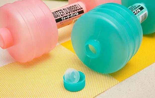 Water-filled fitness dumbbell for women in pink polypropylene plastic with leak-proof port