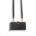 Black detachable wallet backpack phone case open, showing card slots and strong adsorption leather for a smartphone.