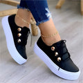 Women's white casual lace-up flats sneakers with rivet detailing and round toe