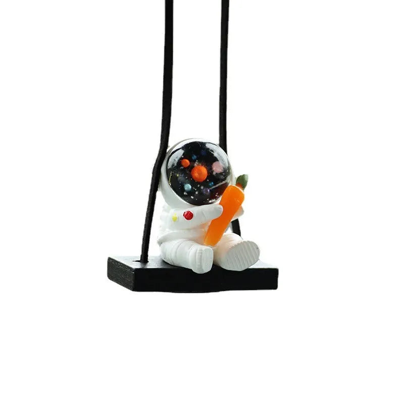 Resin astronaut car pendant showing five cartoon astronaut designs for vehicle decoration