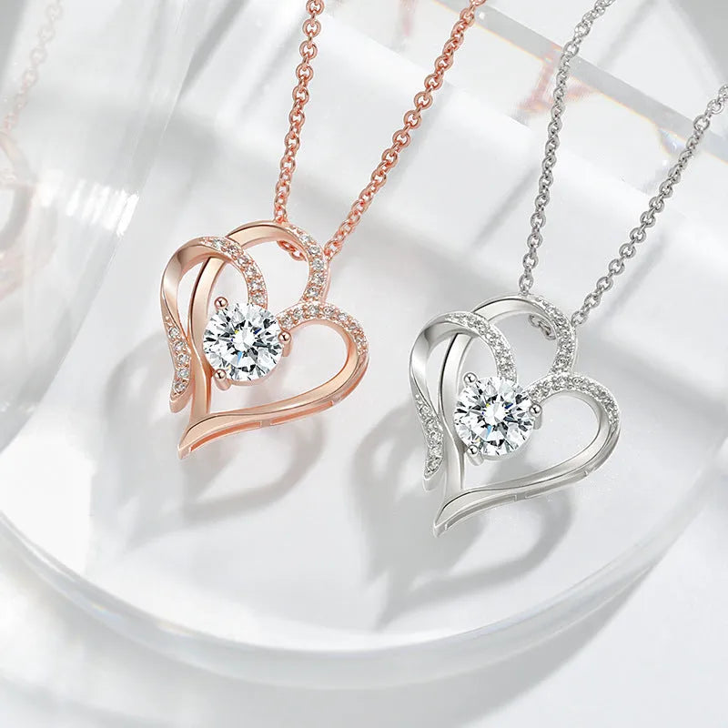 Women's sterling silver heart pendant necklace in rose gold, white gold, or yellow gold plating on a delicate chain.