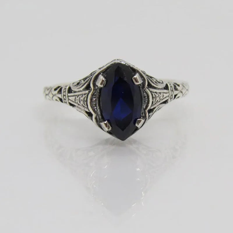 Silver geometric hollow women's ring on a hand, showing its alloy and electroplated construction.