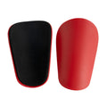 PU mini shin guards in black, white, red, and blue colours for football and sports protection.