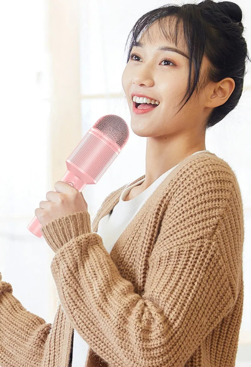 Wireless Bluetooth karaoke microphone in pink, blue, or green colour options.