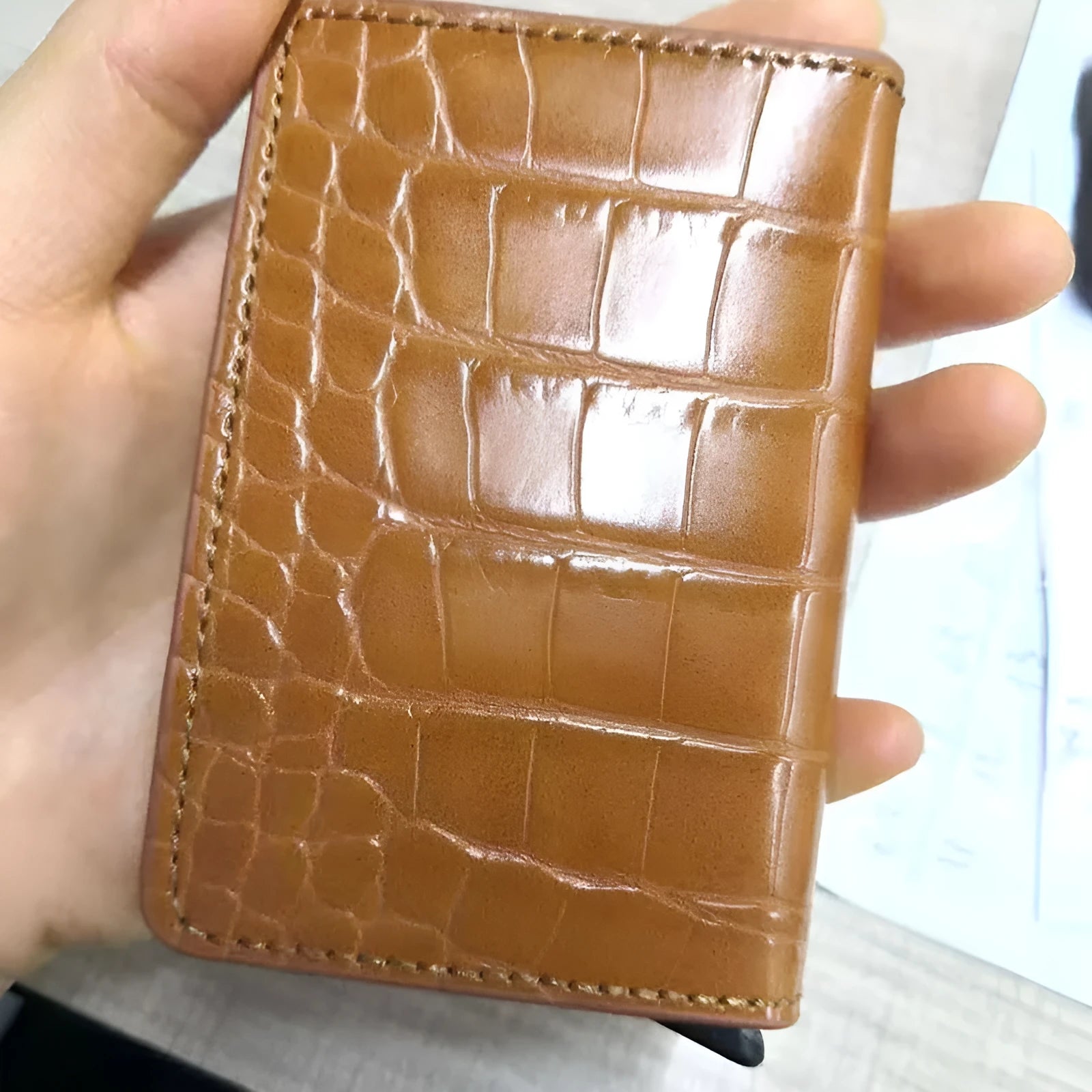 Pattern wallet with metal cartridge automatic pop-up in black polyurethane leather showing card slots