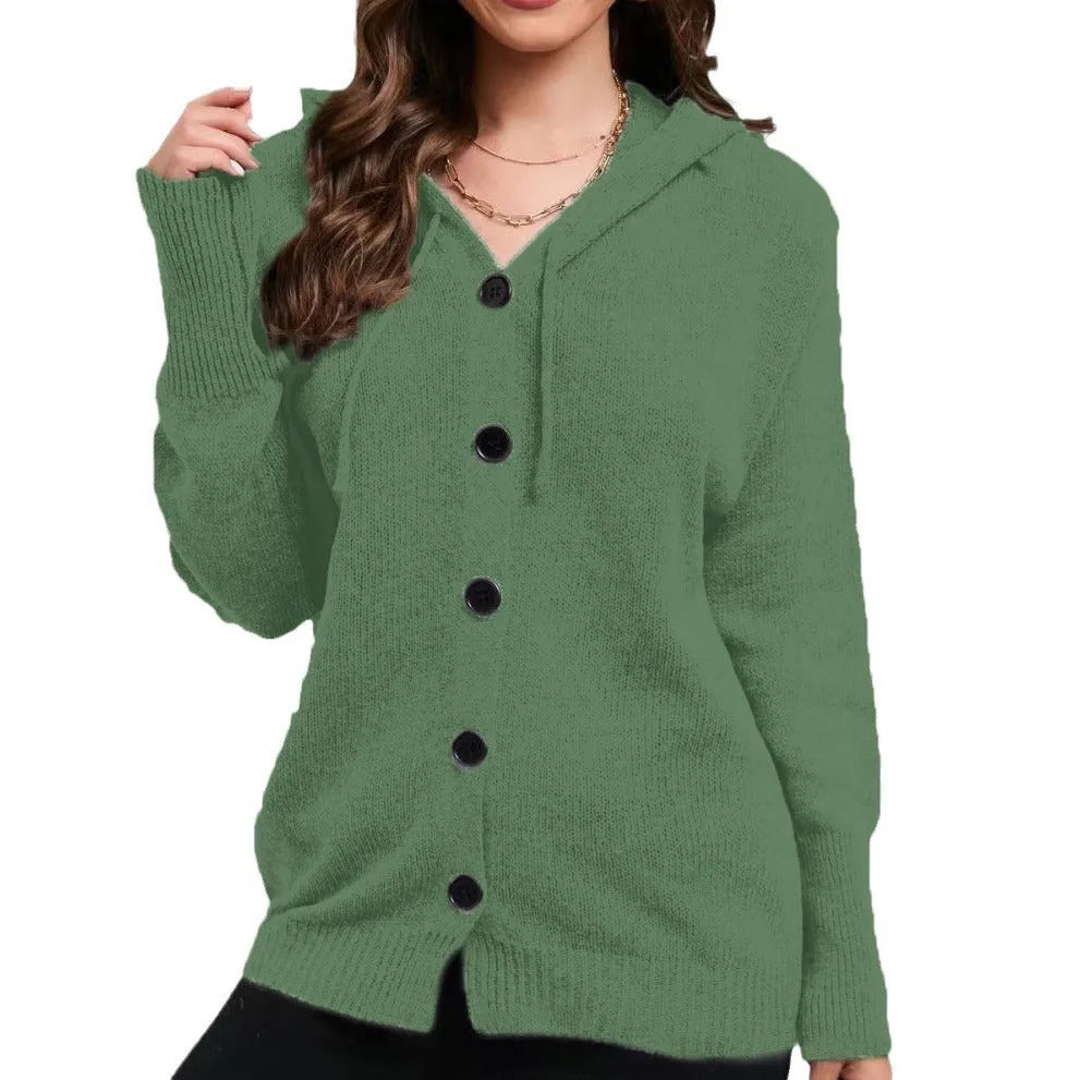A woman wearing a loose-fit, hooded, solid-colour cotton cardigan sweater in a neutral tone.