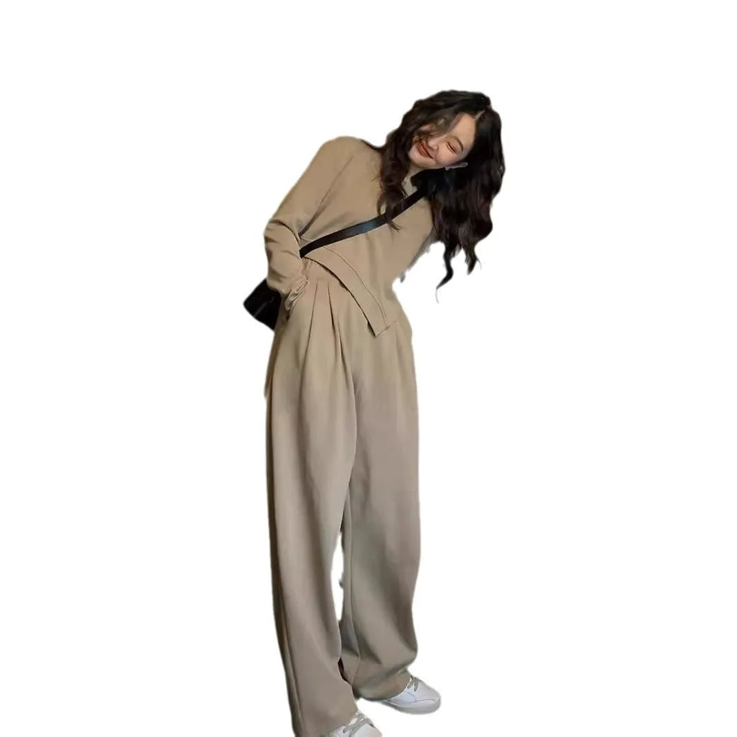 Women's khaki casual sports suit set with long sleeve top and matching trousers on a hanger.