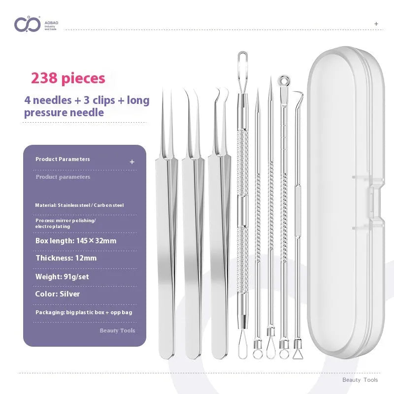 Four silver metal acne needles with pointed tips laid out on a surface.