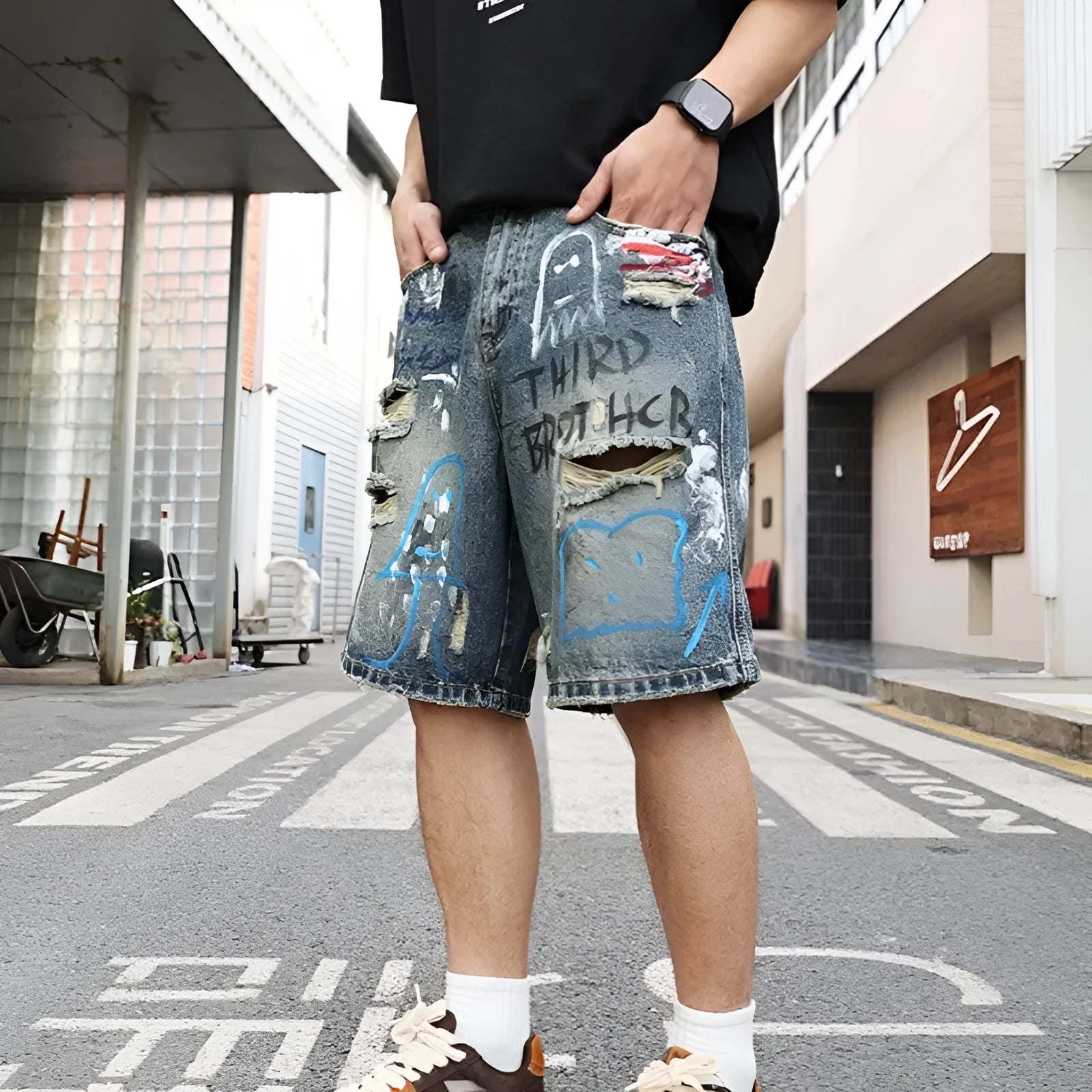 Blue ripped men's denim jeans shorts with graffiti patterns and straight-leg style