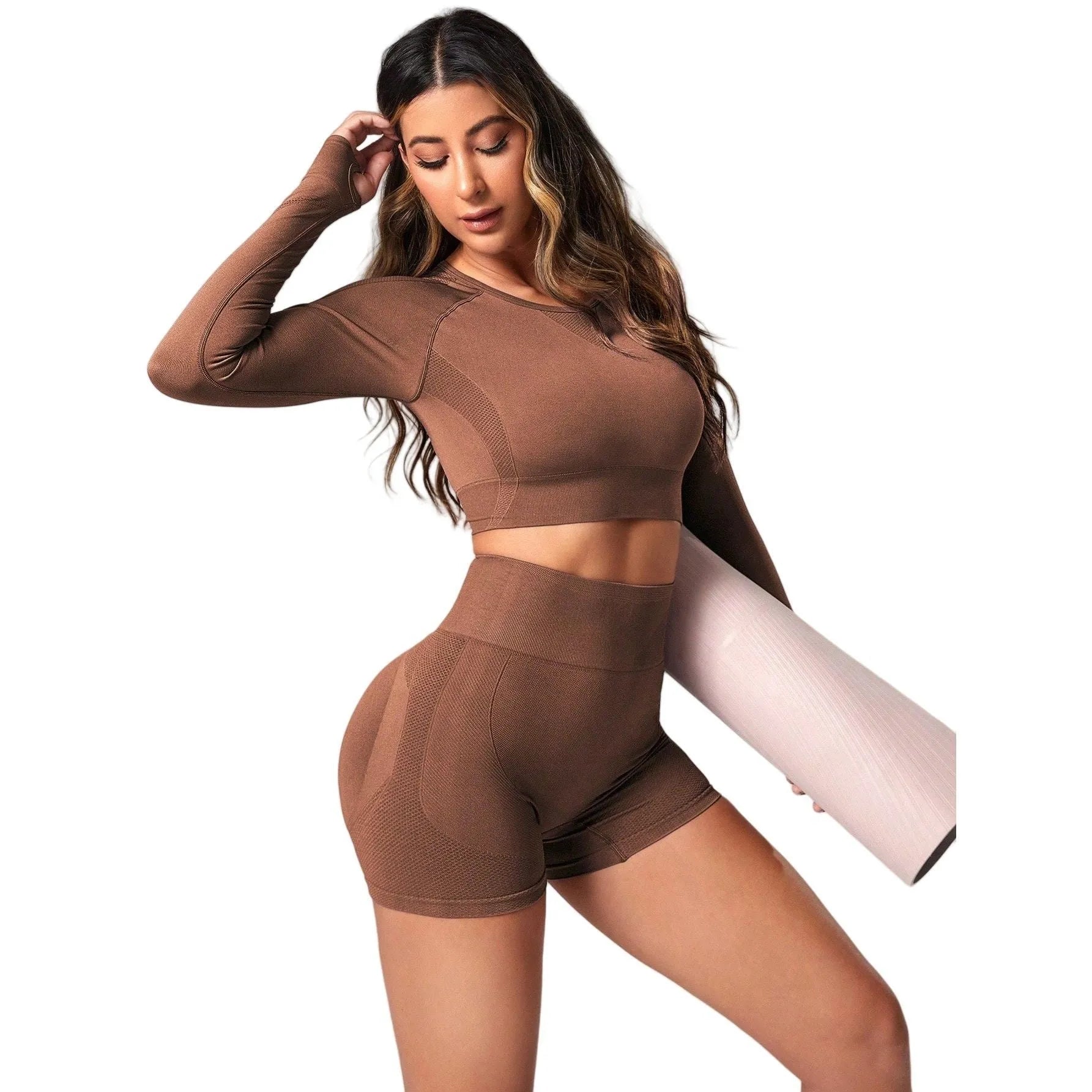 Women's high waist yoga suit in black, brown, or purple colours, showing pullover top and tight-fitting pants.