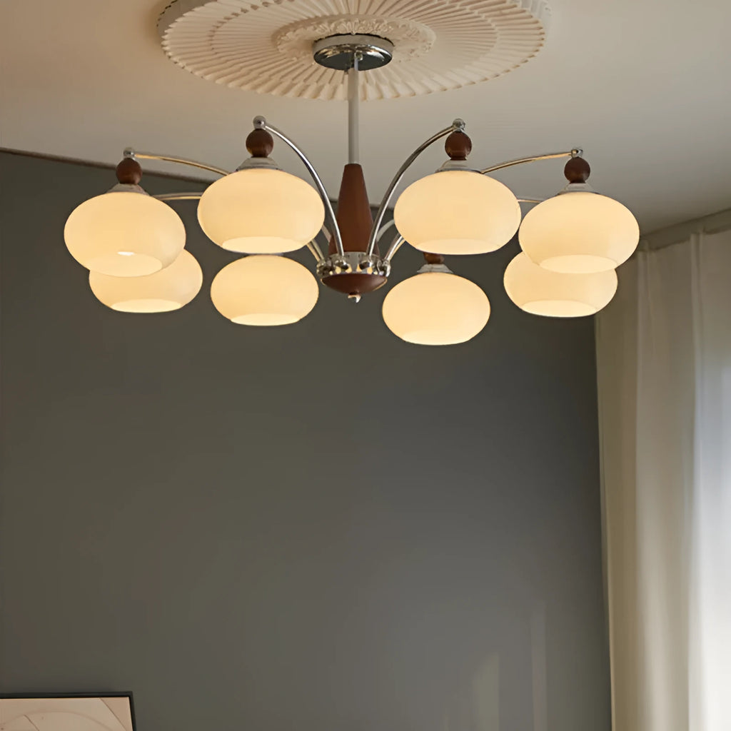 Middle Ancient style persimmon glass chandelier with chrome arms and milky white glass lampshades.