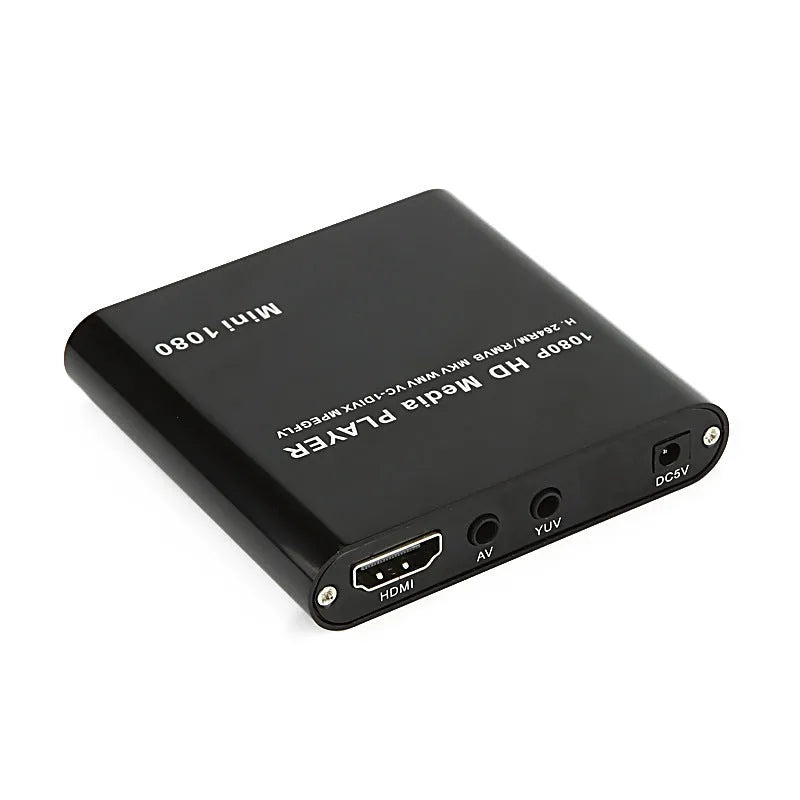 Compact black and blue all-metal 1080p HD media player with remote control on a wooden surface.
