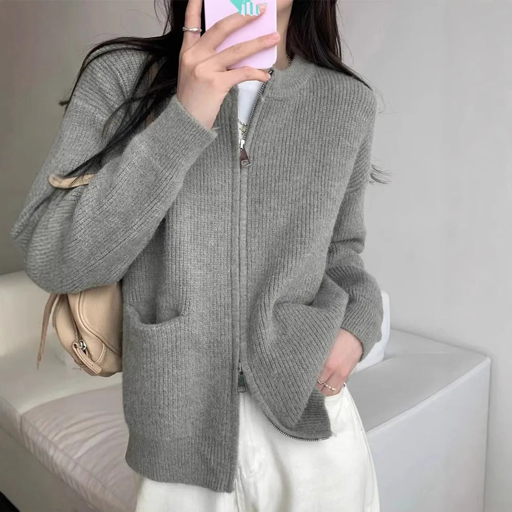 Beige women's soft viscose sweater coat cardigan with long sleeves on a hanger.
