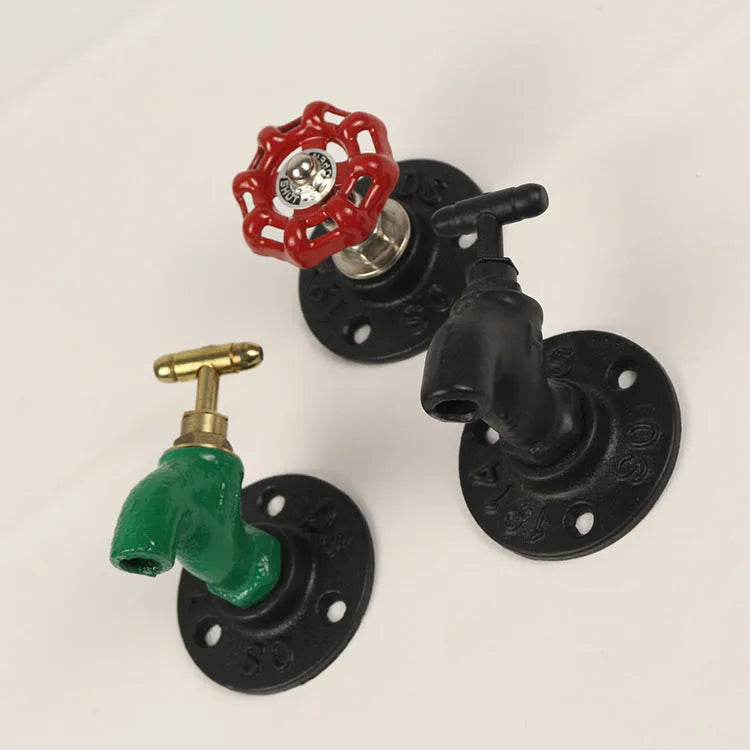Water pipe style metal wall hanging hook for towels, shown in a choice of colours.